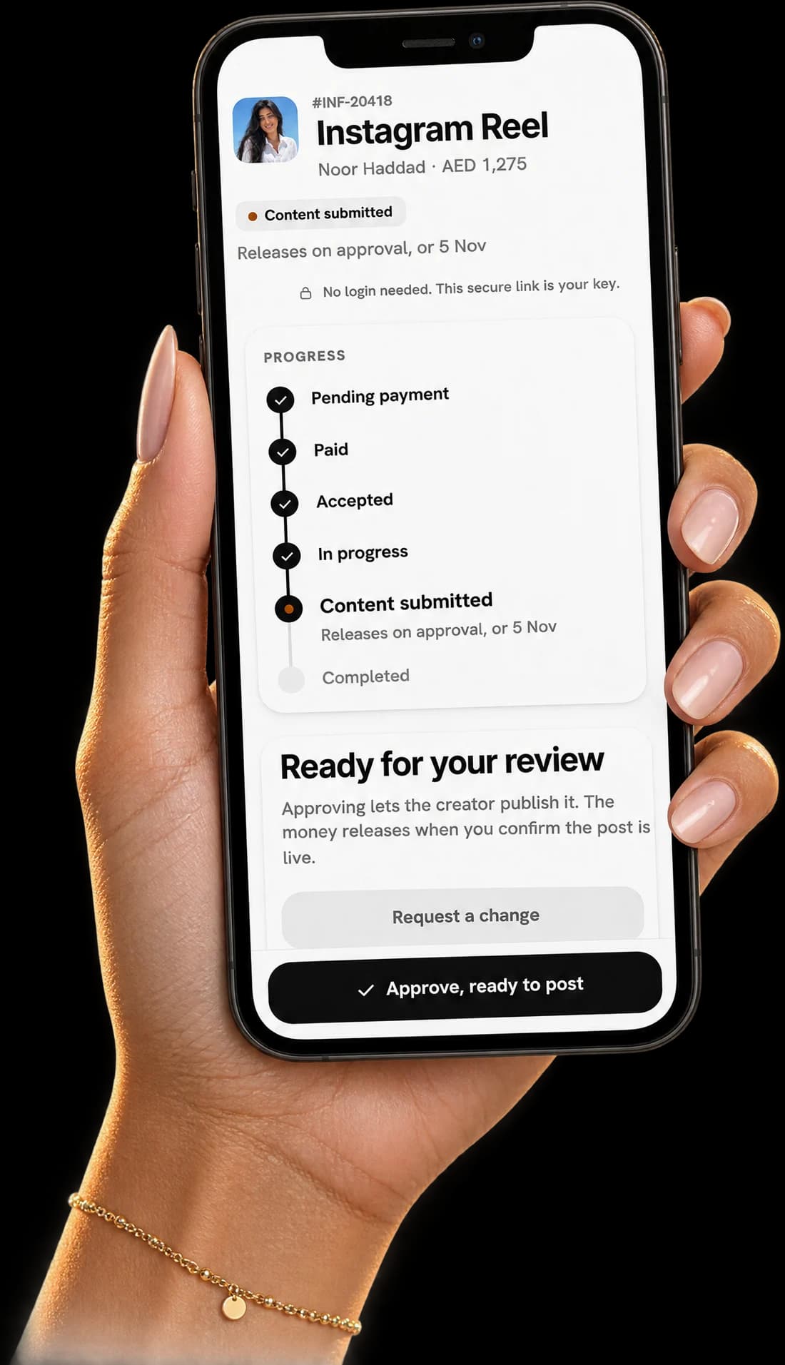 A hand holding a phone showing order tracking on Inflink
