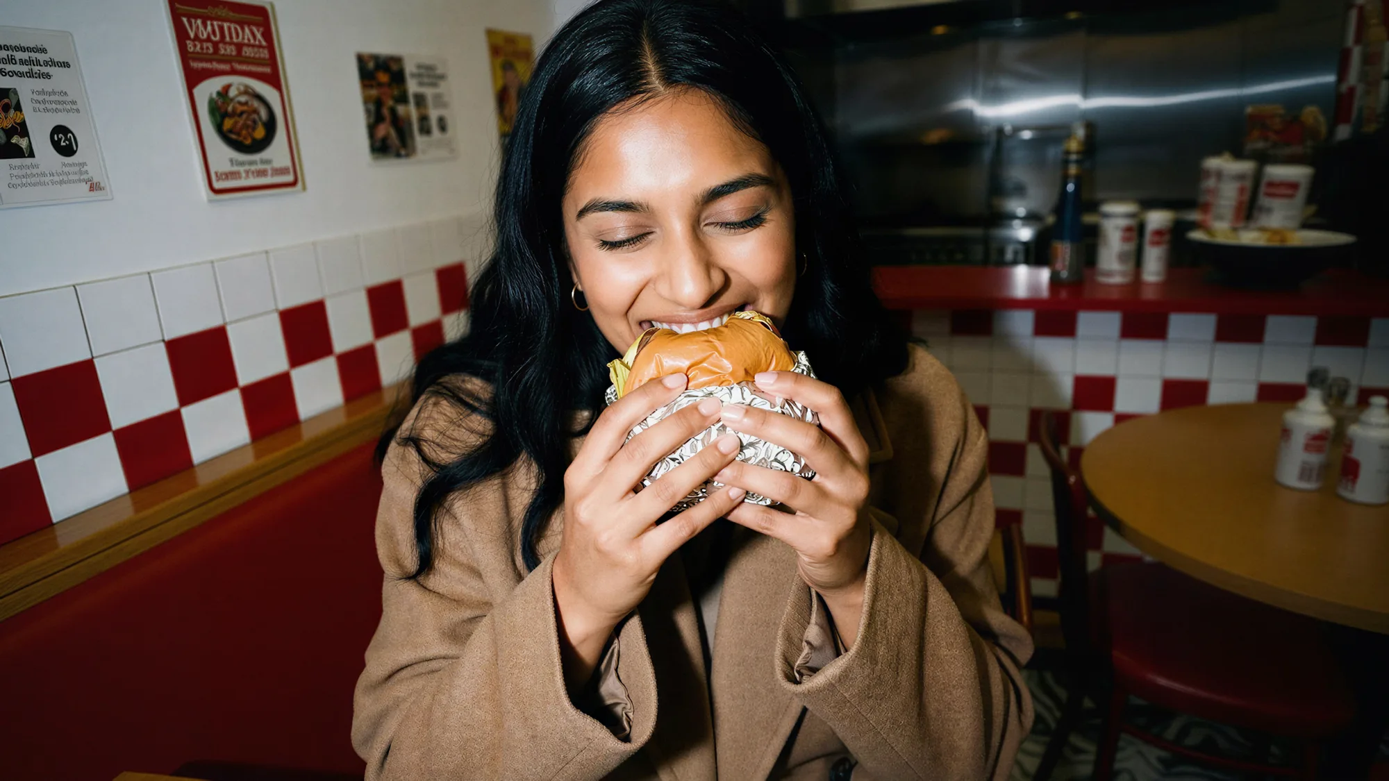 A food creator mid-bite while recording content.